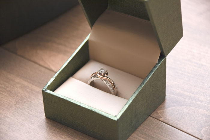 Engagement ring in an open box symbolizing love and commitment, linked to biggest mistake reflections by 68 people.