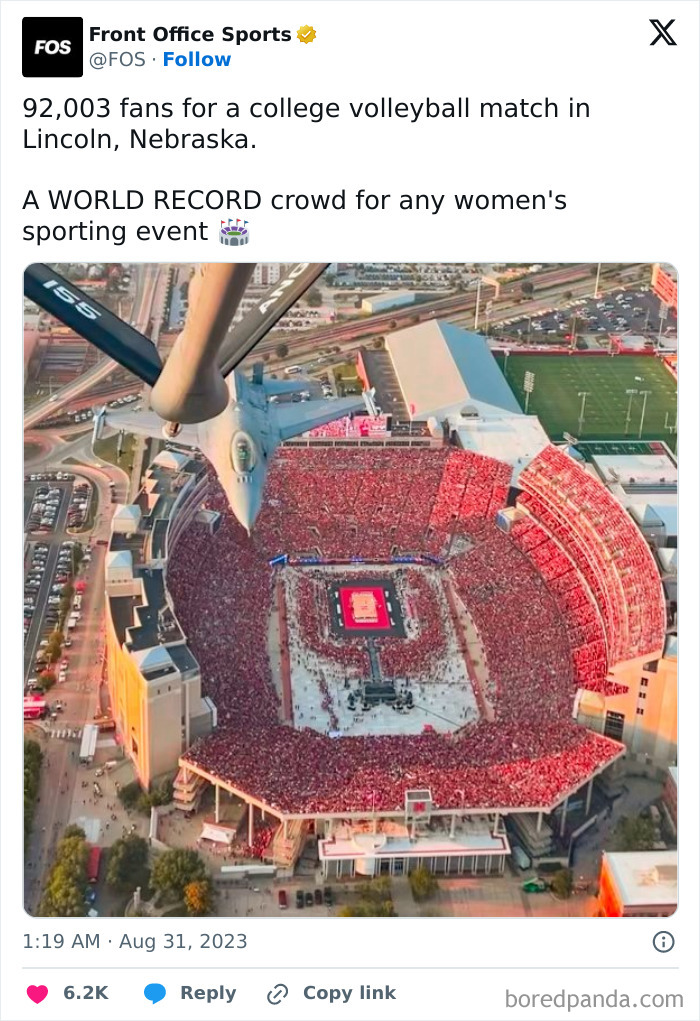 A world record crowd at a college volleyball match in Nebraska, an unreal photograph capturing the massive stadium view.