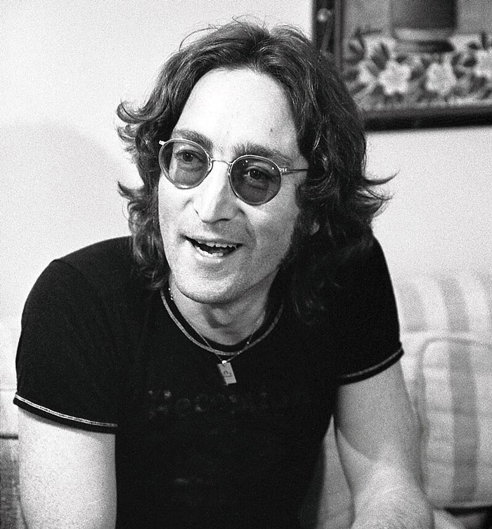 Black and white photo of a famous person wearing glasses and a black shirt, related to famous people who did evil things.