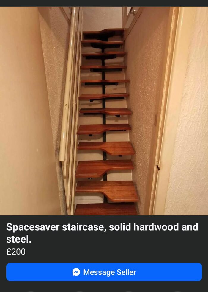 Narrow death stairs made of solid hardwood and steel with an alternating tread design in a tight space.