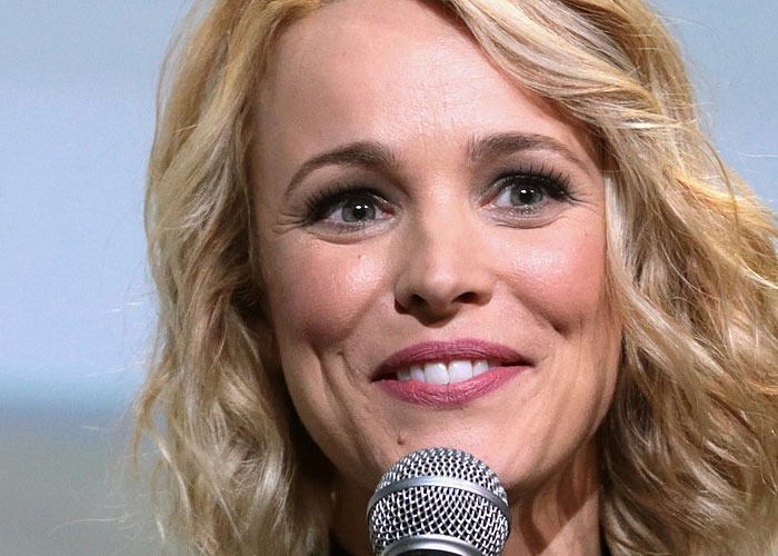 Blonde woman speaking into a microphone, representing celebrities and what they were doing before fame found them.