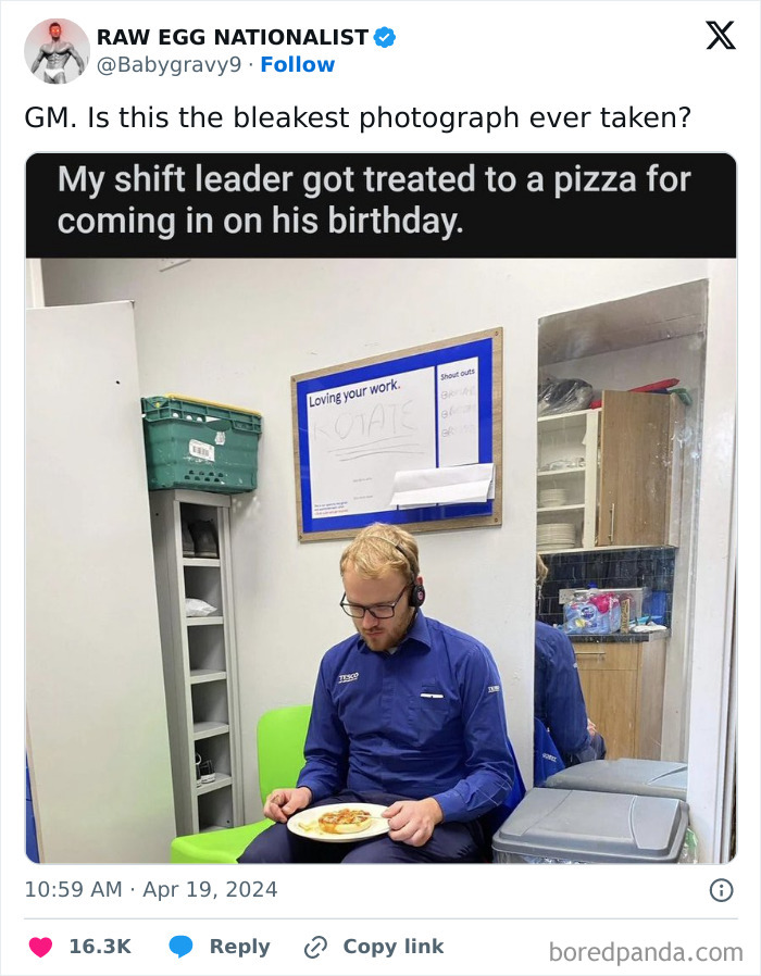 Man in work uniform sitting on a chair with a small pizza, capturing a moment that made people go hmmm and share it.