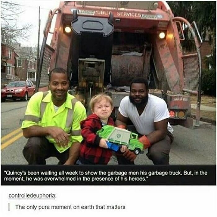 Child holding a toy garbage truck with two garbage men smiling beside a real garbage truck in a feel-good moment restoring faith in humanity.