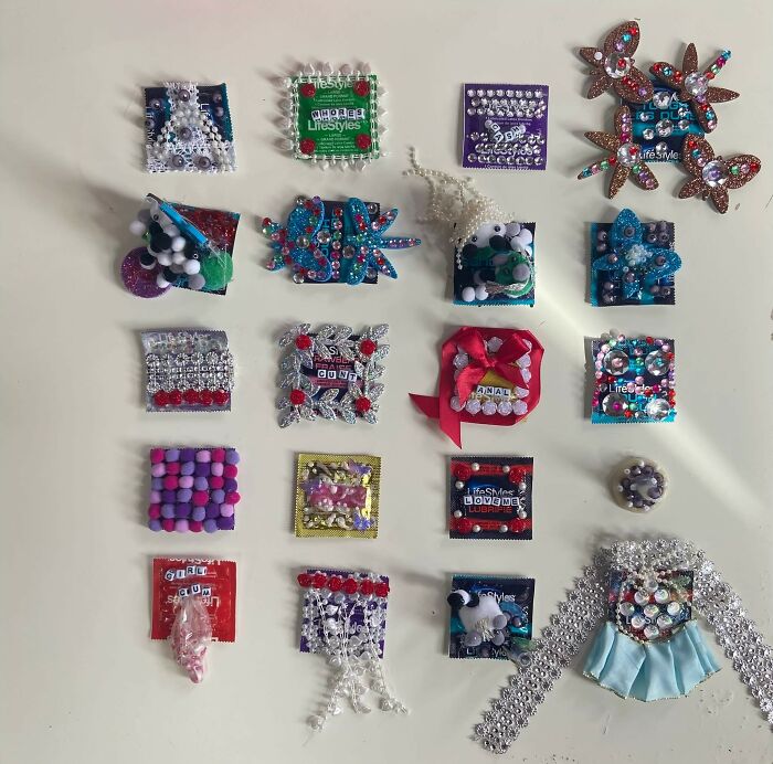 Colorful craft shaming DIY projects with beads, sequins, pom-poms, and decorations on small square bases arranged on a table.