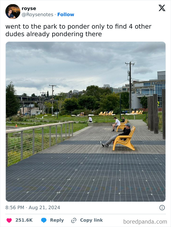 Four men sitting spaced apart on yellow chairs in a park, a funny meme to help you decompress when life gets stressful.