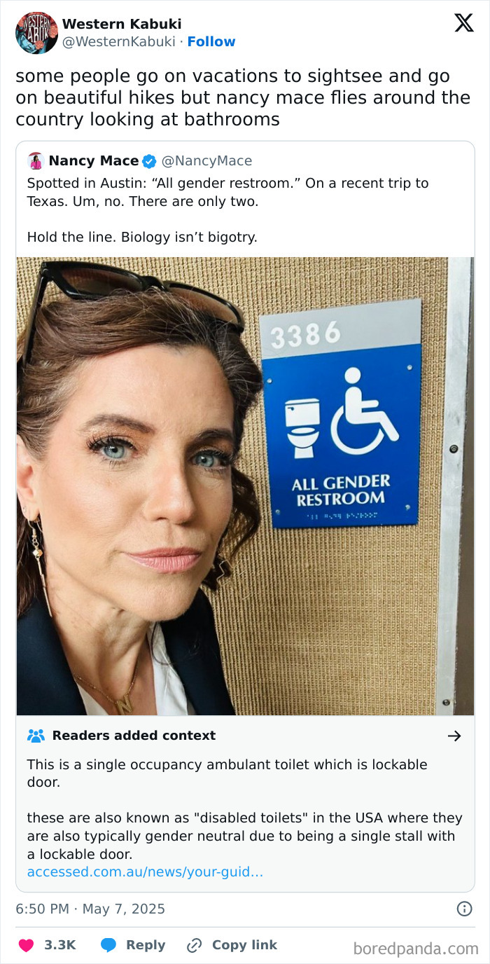 Woman takes selfie next to an all gender restroom sign, featured in powerful memes shared by a Facebook group.