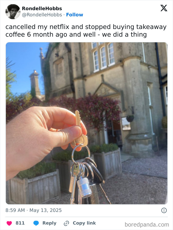 Hand holding keys in front of a large house, illustrating a moment that made people go hmmm and share online.