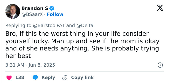 Screenshot of a social media reply about a man&rsquo;s mid-flight meltdown over a screaming baby sparking parenting versus passenger debate.