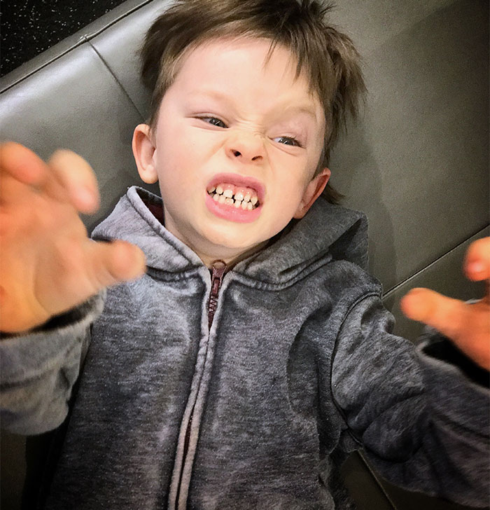 Young boy making a chaotic face and reaching out, illustrating babysitting chaos during a woman’s offer to help SIL. Young boy making a chaotic face and reaching out, illustrating babysitting chaos during a woman’s offer to help SIL.