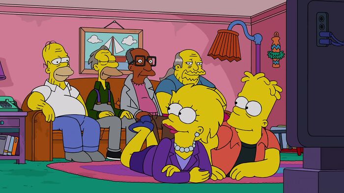 The Simpsons characters sitting in the living room, highlighting Marge&rsquo;s death and other animated character deaths.