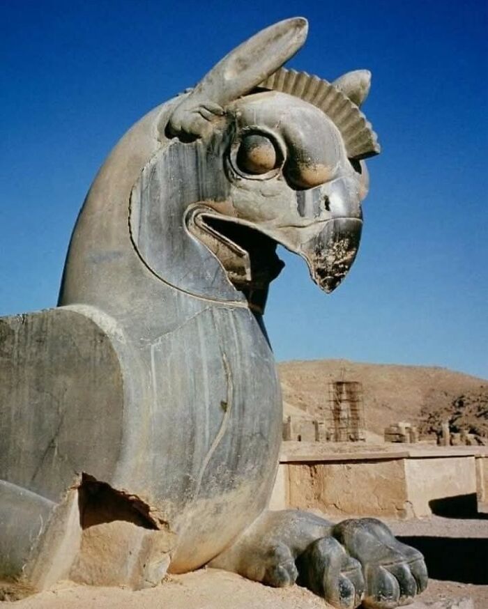 Ancient stone sculpture of a mythical creature at an archaeological site in the archaeology world.