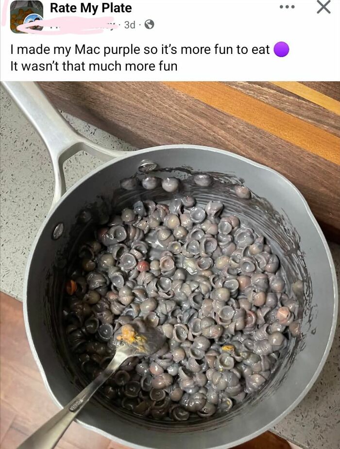 Pot of purple mac and cheese DIY craft shaming project gone wrong with melted purple pasta shells and cheese.