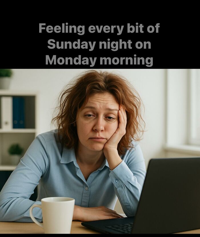 Tired woman at work with messy hair resting head on hand, showing Monday morning struggle and funny work meme feeling.