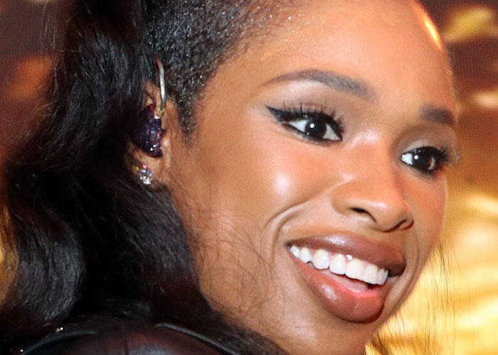 Close-up of a smiling celebrity showcasing what 40 celebrities were doing before fame found them in the entertainment industry.