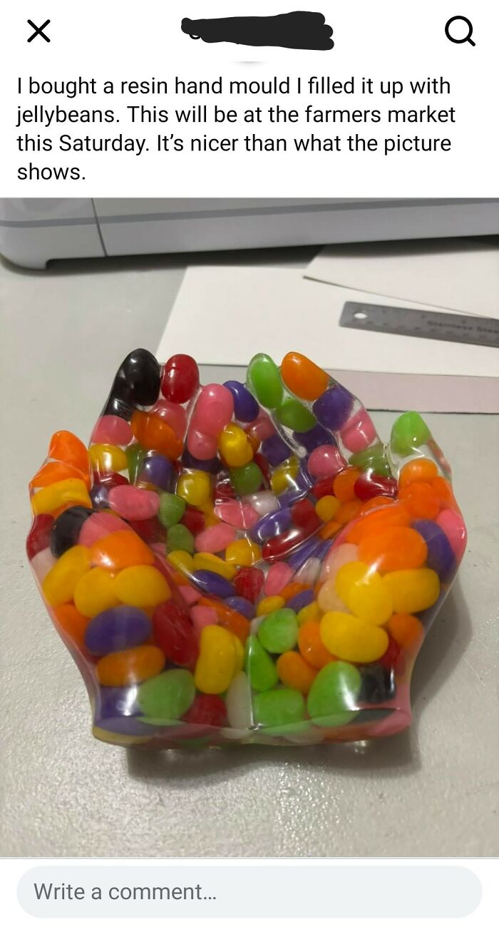 Resin hand mold filled with colorful jellybeans, an unusual and humorous DIY craft project.