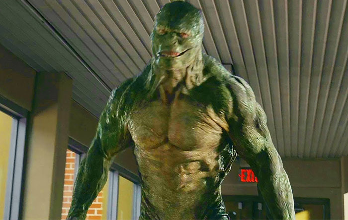 A muscular green creature with reptilian features standing in a hallway, related to wild things people say they've seen.