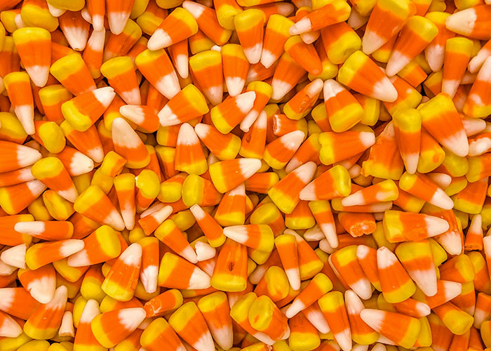 Close-up of colorful candy corn pieces representing a chaotic buffet setting described by buffet workers' wildest encounters.