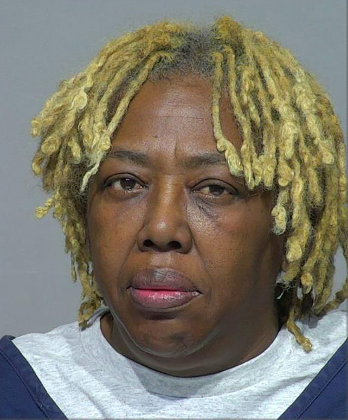 Woman with blonde dreadlocks in a mugshot photo, related to viral marriage honest explanation after shooting husband case.