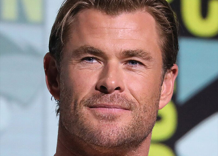 Close-up of a male celebrity with light beard and blue eyes, representing what celebrities were doing before fame.