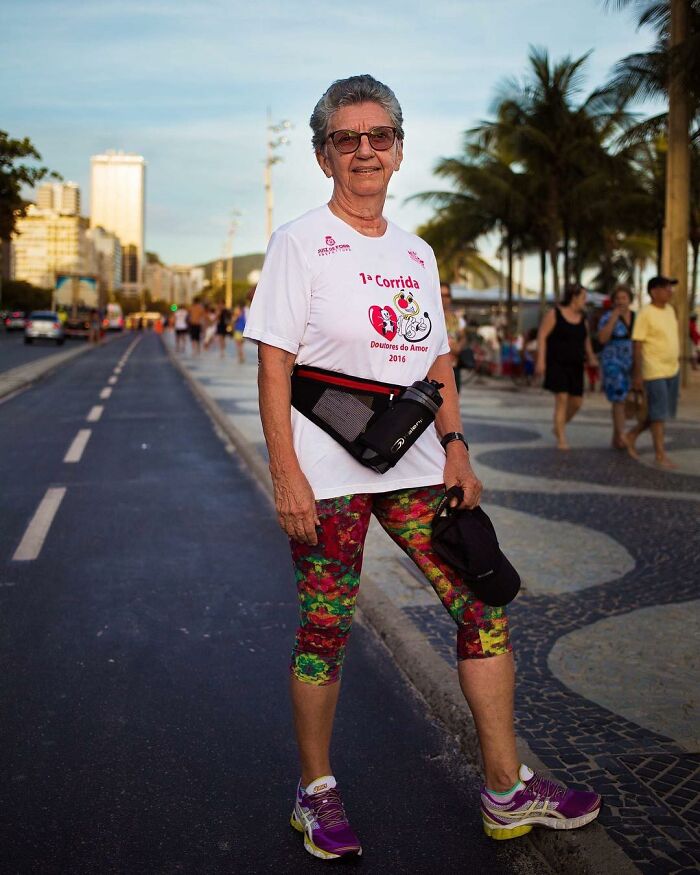 Elderly woman in activewear posing confidently on a city street, showing beauty has no expiration date.