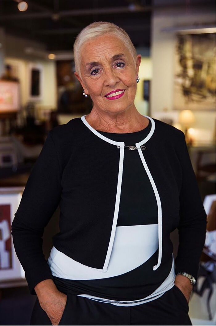 Elderly woman smiling confidently indoors, showcasing timeless beauty and grace, embodying beauty with no expiration date.