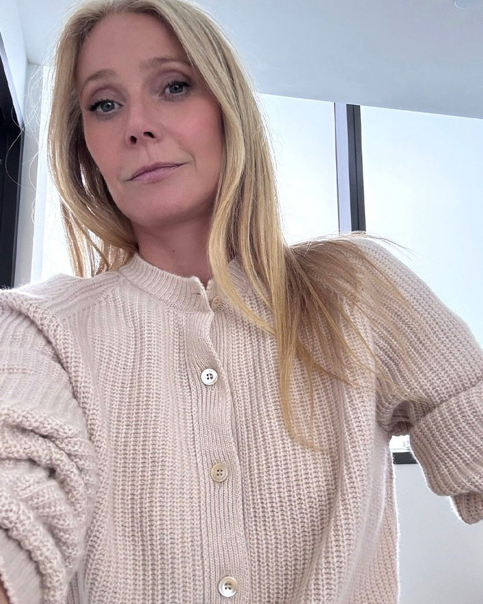 Female star posing indoors in a beige knitted sweater, representing stars who found new homes abroad from Hollywood.