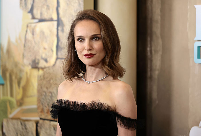 Female Hollywood star in elegant black dress, representing stars who said goodbye to the US and found new homes abroad.