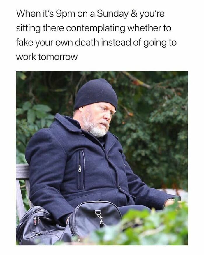 Man in a navy coat and hat sitting on a bench looking tired, relatable funny work meme about Sunday evening thoughts.