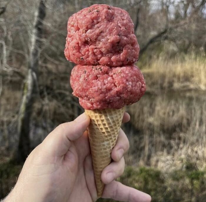 Ice cream cone with two scoops of raw ground meat, a cursed picture of food that might make you go eeeeeuw outdoors.
