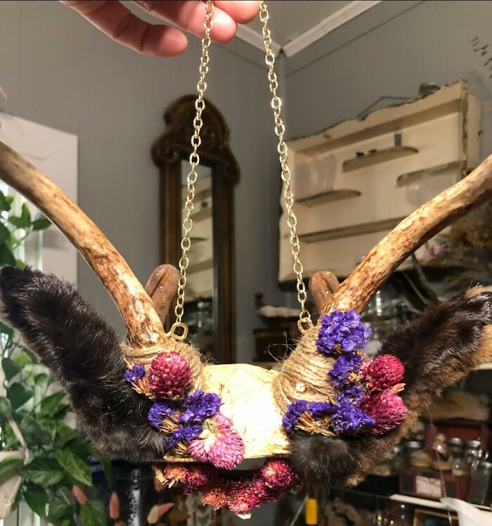 Handmade floral and fur craft project with antlers and gold chain, example of horrendous DIY craft shaming fails.