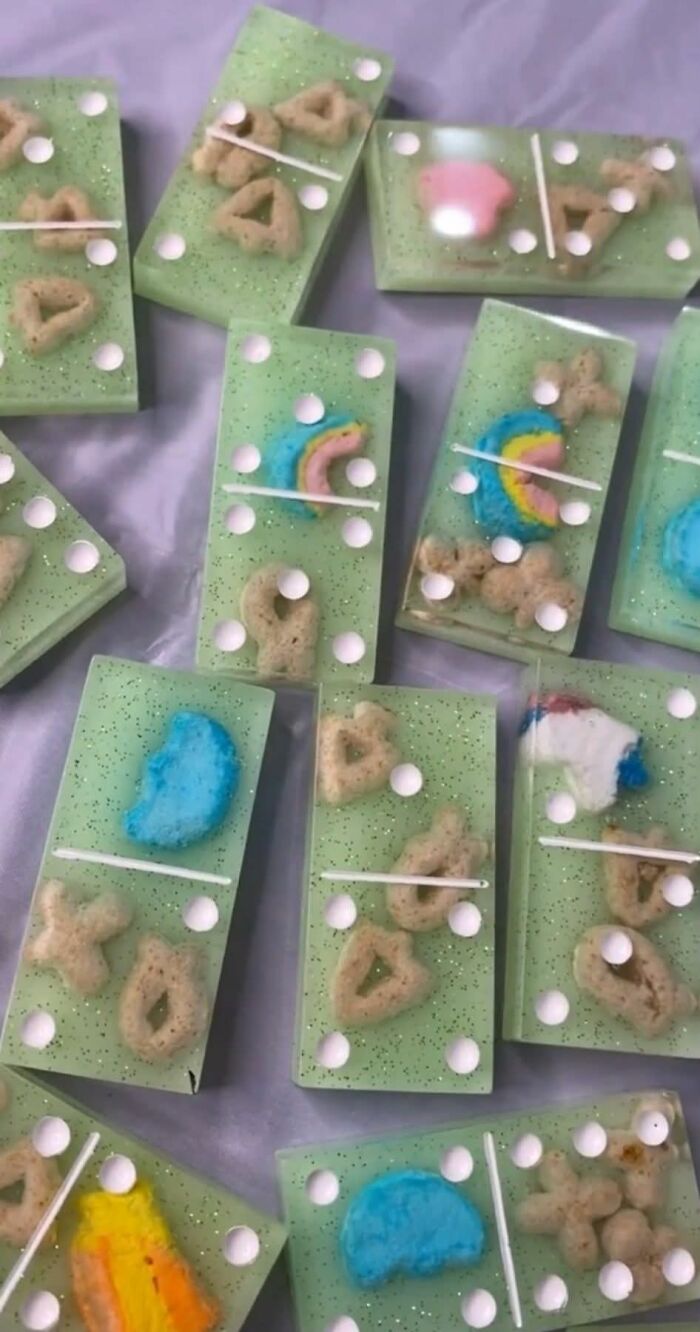 Resin crafts resembling dominos with uneven shapes and colorful but poorly made designs, showcasing horrible crafts.