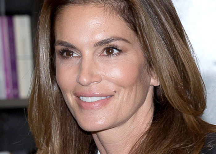 Close-up of a female celebrity smiling, highlighting what 40 celebrities were doing before fame found them.