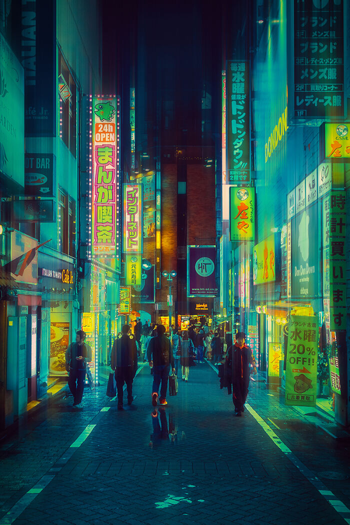 Night street scene with neon signs and pedestrians in a vibrant city, showcasing breathtaking travel photos atmosphere.