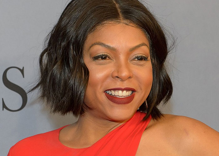 Actress with short wavy hair in a red dress smiling at an event, representing celebrities before fame found them.