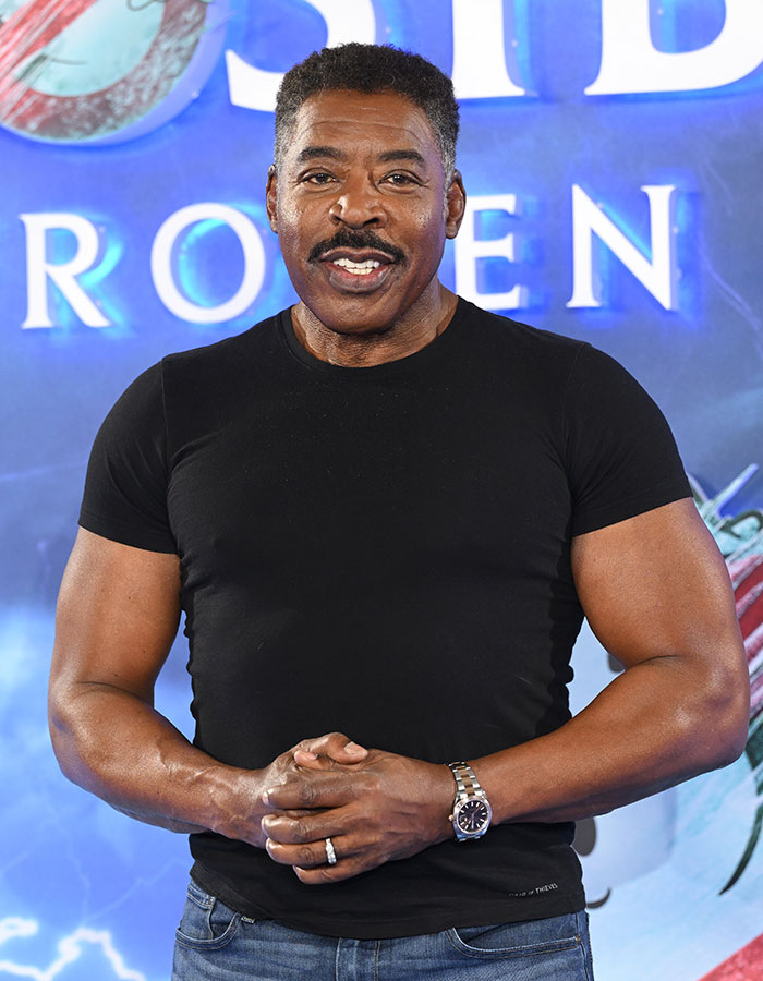 African American male celebrity in a black t-shirt smiling, showcasing celebrities who look way younger than they actually are.