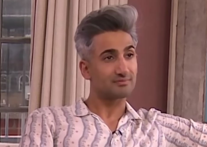 Man in a patterned shirt sitting indoors, representing celebrities before fame and their early careers.