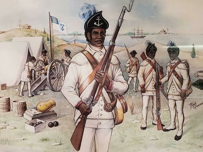 African American soldiers in historical military uniforms holding muskets at a camp, illustrating military history.