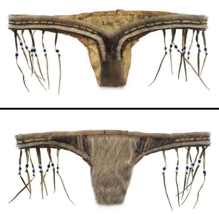 Traditional indigenous historical loincloth made from animal hide and decorated with beads and sinew strands in archaeology world.