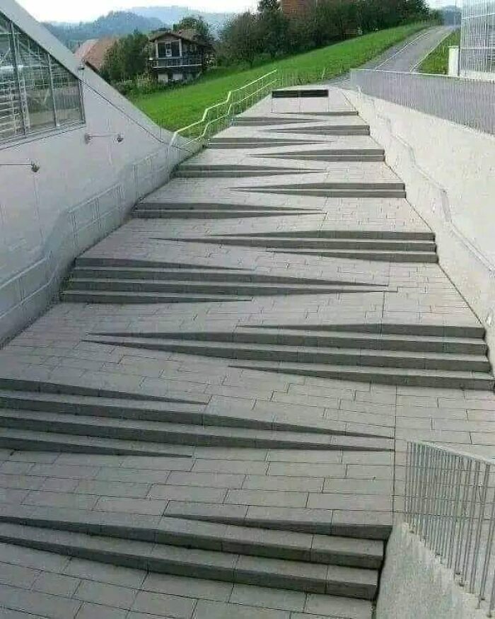 Uneven and varying height death stairs in an outdoor setting, making taking the stairs a risky option.