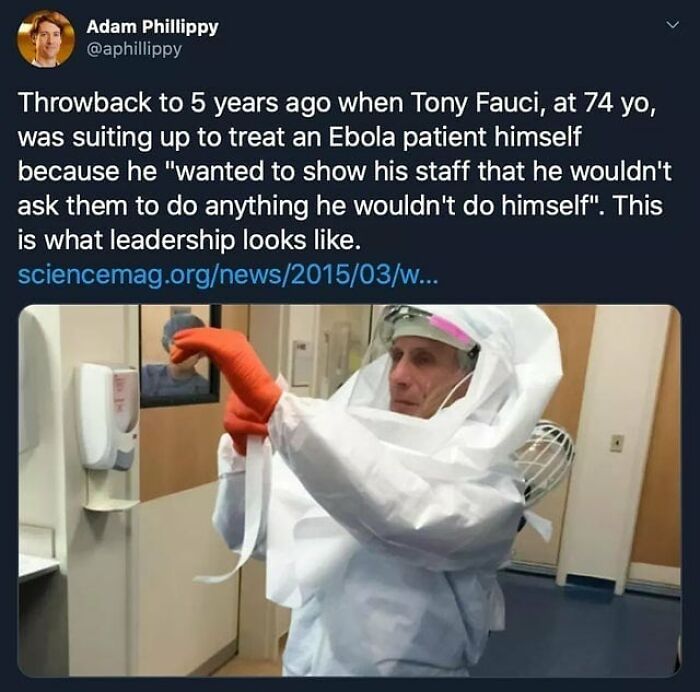 Man in full protective gear putting on gloves, illustrating leadership and feel-good moments restoring faith in humanity.