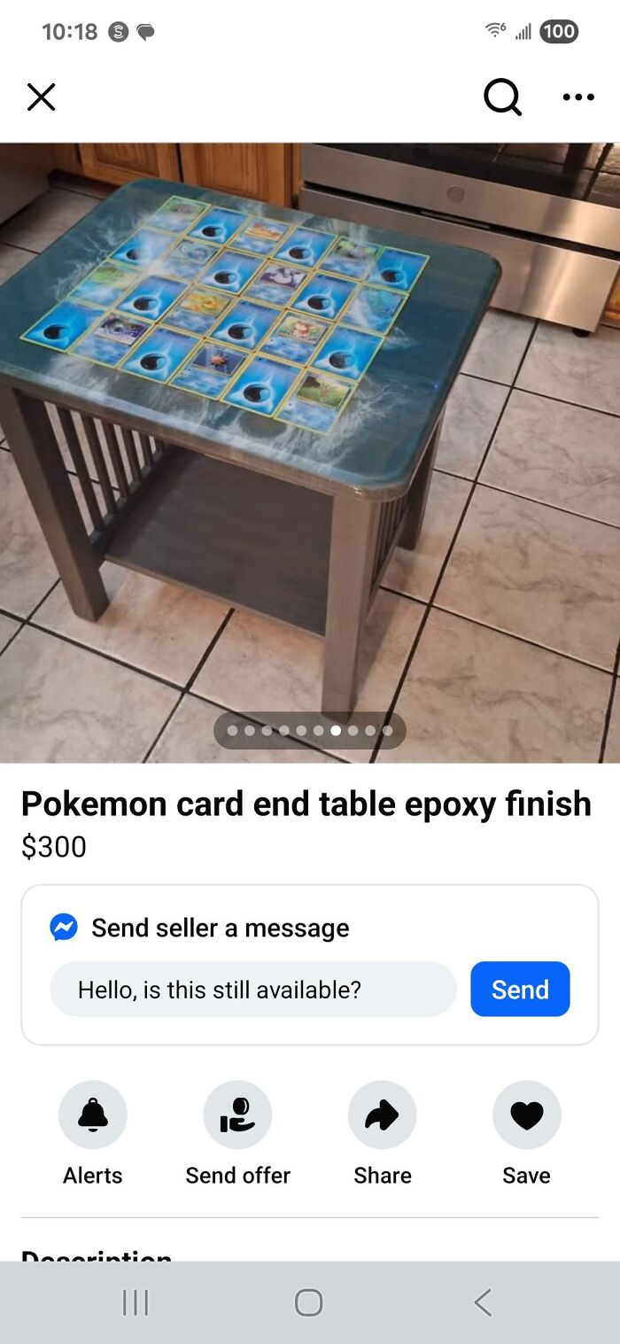 DIY epoxy end table with Pokemon cards embedded under a glossy resin finish on a tiled kitchen floor background