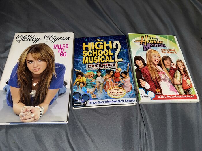 DVDs featuring Miley Cyrus, High School Musical 2, and Hannah Montana, reflecting nostalgia for Millennials and Gen Z culture.