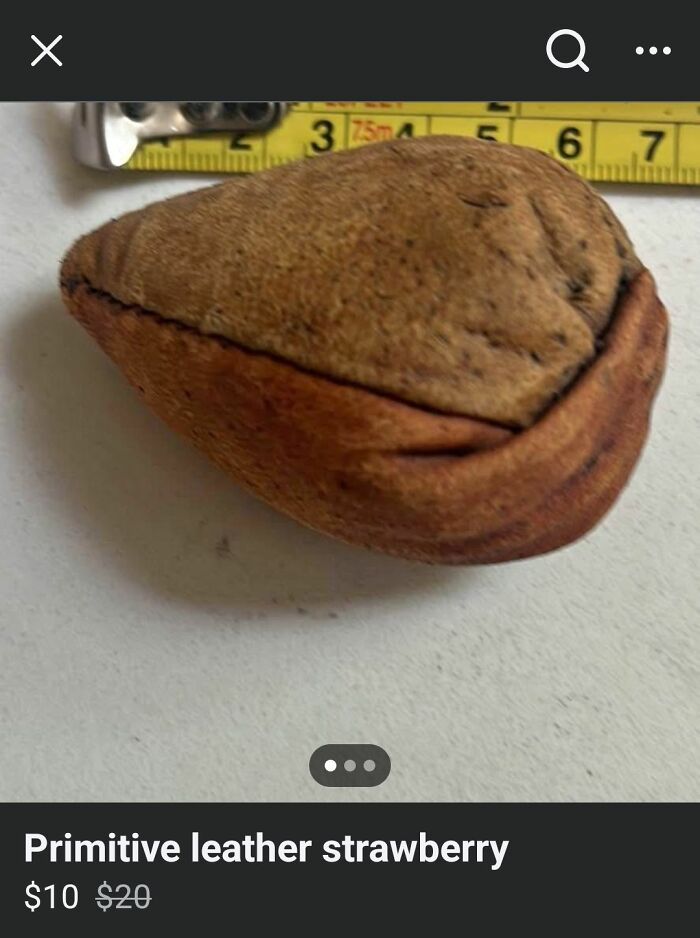 Primitive leather craft project resembling a strawberry, featured among horrendous DIY projects needing craft shaming.