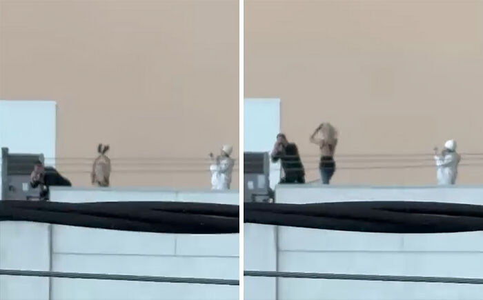Two unhinged influencers on a rooftop filming a risky stunt for views, capturing the craziest moments for social media.