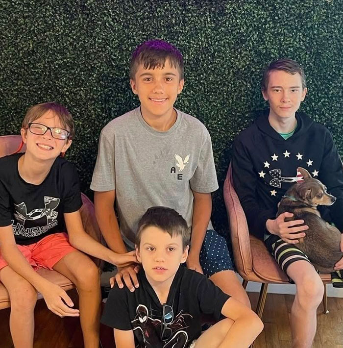Four boys sitting together indoors, highlighting 16 and Pregnant star Whitney Purvis's loss of her 16-year-old son.