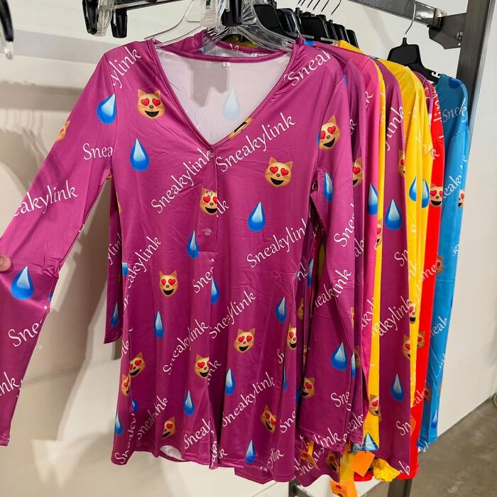 Colorful secondhand long-sleeve tops with emoji patterns hanging on a rack, showcasing cool secondhand finds.