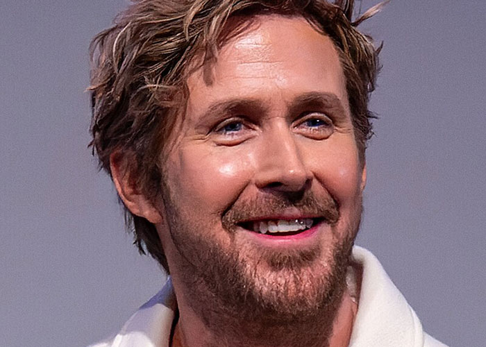 Close-up of a smiling man with a beard, illustrating what these 40 celebrities were doing before fame found them.