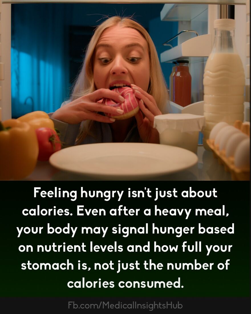 Woman eating a pink donut from the fridge, illustrating curious medical facts about hunger and nutrient signals in the body.
