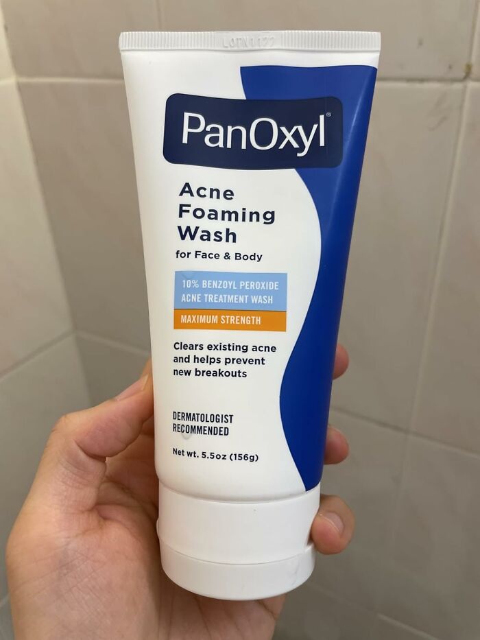 PanOxyl acne foaming wash held in hand, an affordable Prime Day deal under $25 to keep your bank account safe.
