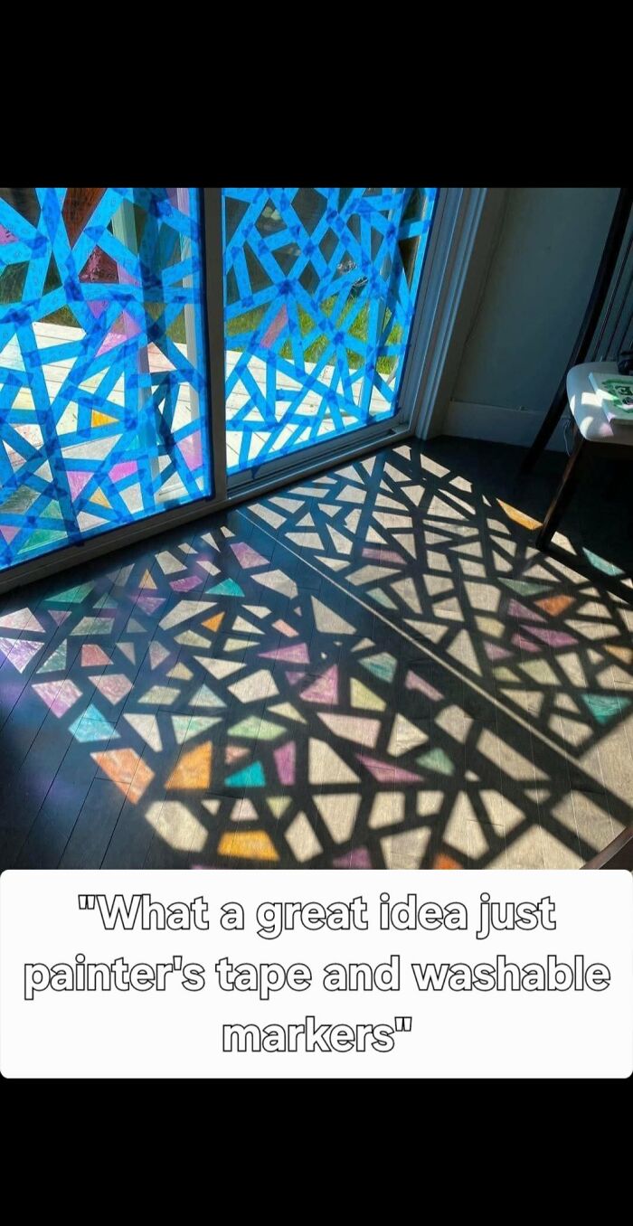 Colorful geometric patterns made with painter's tape and markers on window casting vibrant shadows indoors DIY craft project.